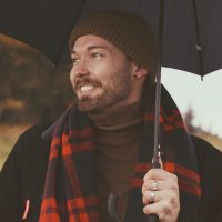 Man With Umbrella Smiling