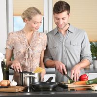 Woman And Man Cooking