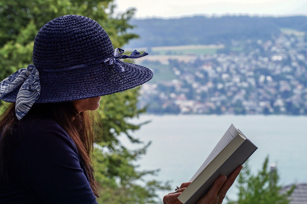 Woman With Hat Reading A Book